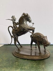 Pig sticking. An unusual old figural group showing horseman and hog.