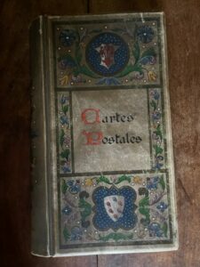 Italian post card album of hand painted vellum, early 1900s with about 175 cards