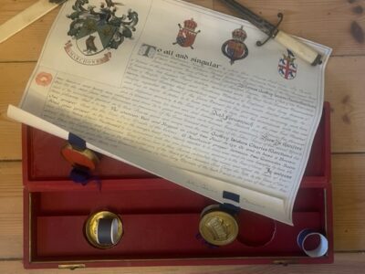 HERALDRY. George V period grant of arms with original seals and red leather gilt box. HERALDRY. George V period grant of arms with original seals and red leather gilt box.