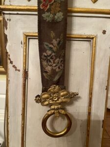 Victorian bell pull of tapestry with gilt brass handle. Victorian bell pull of tapestry with gilt brass handle.