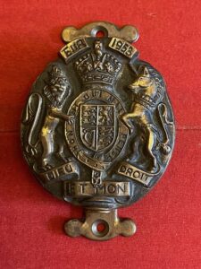 Brass door knocker with a vdrsion of the Royal Arms, dated 1953