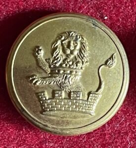 Armorial livery button showing a demi lion with a mural crown. Armorial livery button showing a demi lion with a mural crown.