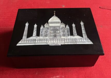 Taj Mahal. A black stone box inlaid with an image of the Taj Mahal of Agra Taj Mahal. A black stone box inlaid with an image of the Taj Mahal of Agra