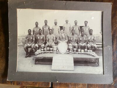 Indian champion regimental sports team with trophies, 1924