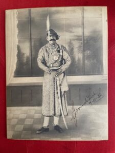 DATIA. A signed and dated photographic print of the Maharaja, 1931