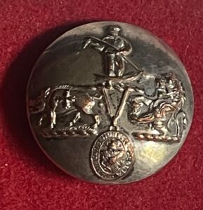 An unusual armorial livery button with three crests and a pendant badge An unusual armorial livery button with three crests and a pendant badge