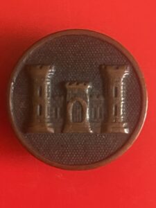 Castle badge on circular copper coloured lapel or hat pin, 27mm