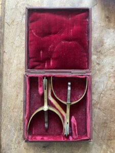 A pair of 19th century brass and steel spurs in the original leather covered case.