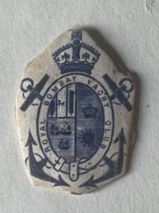 Royal Bombay Yacht Club. Armorial coat of arms embossed in blue Royal Bombay Yacht Club. Armorial coat of arms embossed in blue