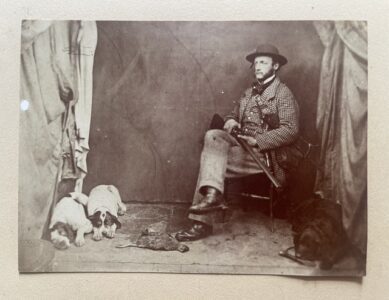 Scottish hunter. A mid Victorian photograph of a hunter with his dogs and a kill Scottish hunter. A mid Victorian photograph of a hunter with his dogs and a kill